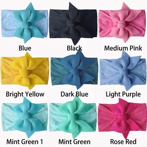 Set of nine colorful nylon baby headbands featuring soft ribbed elastic and big bows