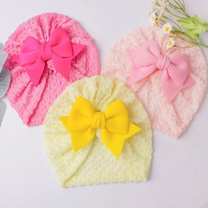 Three-color set of breathable baby beanie hats with large bows in pink and yellow