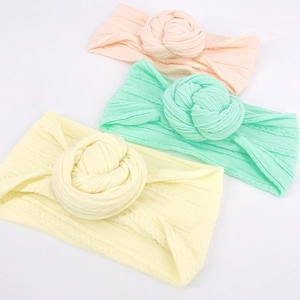 Set di tre fasce per neonati in nylon morbido nei colori rosa, verde e giallo pastello