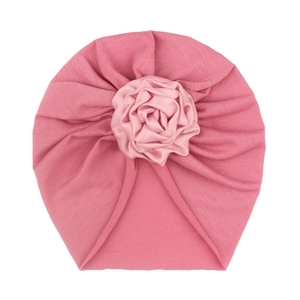 Infant turban hat in bright pink with elegant satin rose flower ornament