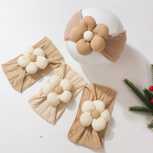 Set of four infant jacquard floral headbands in earthy tones with soft knit texture