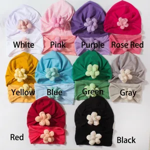 Flat lay of baby flower hat and headband sets in ten vibrant colors for girls