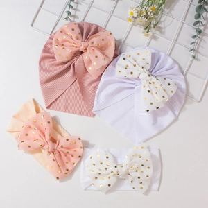 4-piece baby hat and headband set with gold polka dot bows and ribbed pink and white fabric