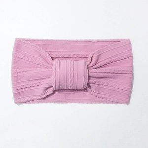 Pink knitted baby headband with large bow detail, soft elastic nylon fabric for infants