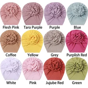 Macro display of twelve colorful ribbed baby turbans with large flower details