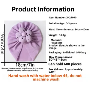 Detail of purple infant turban hat featuring soft honeycomb texture and cloth flower decor