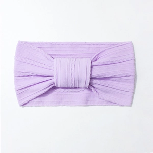 Detailed knit texture of light purple nylon baby headband with jacquard knot design
