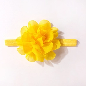 Detailed view of handmade yellow chiffon flower headband with elastic band for infants