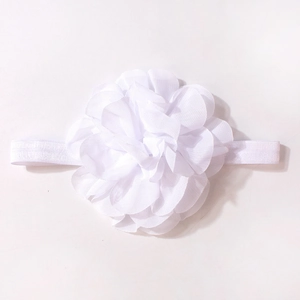 Detail of multi-layered white chiffon flower headband with elastic band for infants