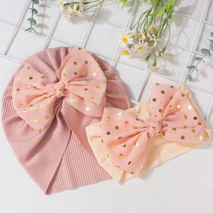 Newborn baby turban hat and headband set with pink gold-dotted bows in soft ribbed cotton
