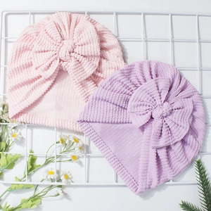 Newborn baby hats with cute stripe texture and large bowknot in pink and purple