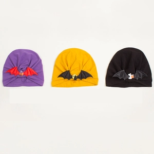 Infant Halloween turban beanie set with pumpkin and bat wing patterns on knit cotton