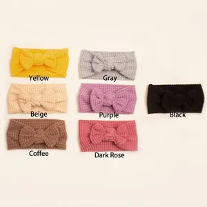 Soft waffle knit baby headbands with large bows in seven solid neutral colors
