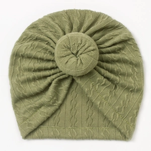 Detailed knit texture of olive green baby turban hat with a decorative donut knot