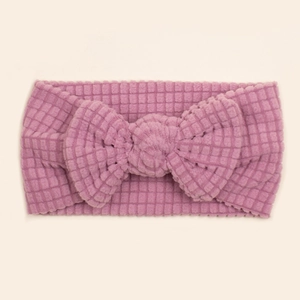 Soft waffle knit baby headband with large bow in pastel purple for infants