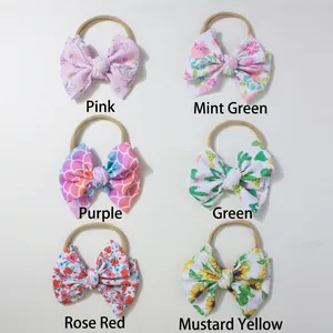 Set di sei fasce per neonati elastiche con stampe floreali colorate e fiocchi grandi