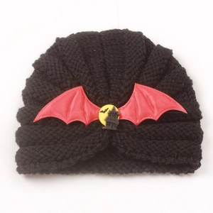Winter knitted beanie for babies with festive Halloween bat and moon patch design