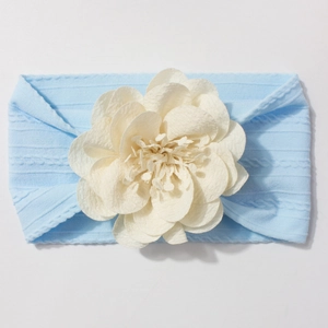 Bandeau élastique bleu clair pour bébé avec grande fleur en tissu crème pour l'été