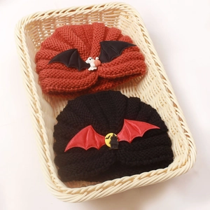 Cozy Halloween baby knit beanies in pumpkin and bat designs for festive warmth