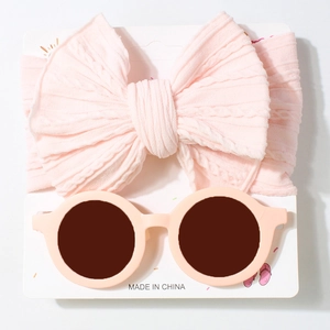 Pink knitted headband with oversized bow and round sunglasses set for baby girls