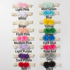 Detailed grid of 16 colored lace baby headbands with chiffon double flower design