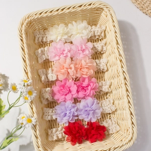 Set of 6 colorful chiffon flower lace headbands for babies in a woven basket