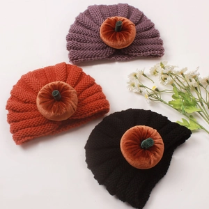 Three-pack Halloween knit baby pumpkin hats in purple, orange, and black colors