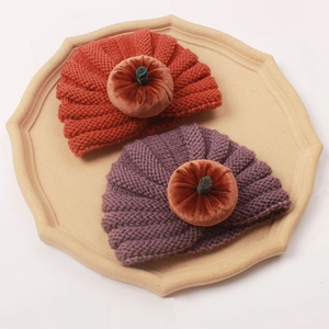 Halloween baby pumpkin knit hats in orange and purple with velvet stem details