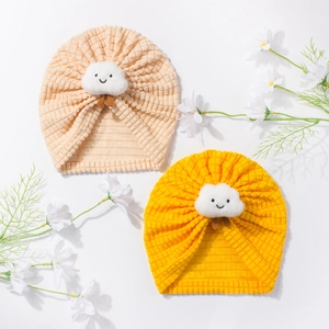 Cute baby beanie with smiling cloud plush patch in light orange and yellow ribbed fabric