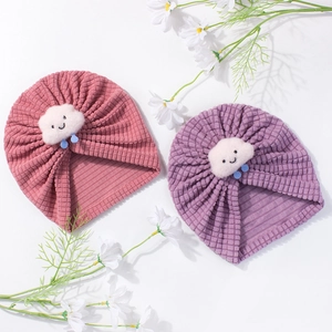 Cute cloud knitted baby hats in coral pink and lilac with soft corn kernel texture