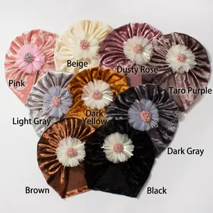 Detailed collection of nine colorful velvet baby beanies with layered 3D flower ornaments