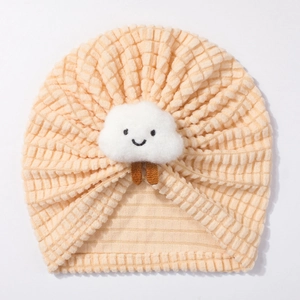 Detail of soft waffle knit baby turban hat with cute smiling plush cloud decoration