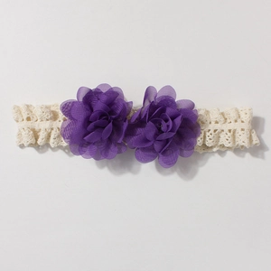 Detail of baby lace headband featuring purple chiffon flowers and creamy elastic mesh lace
