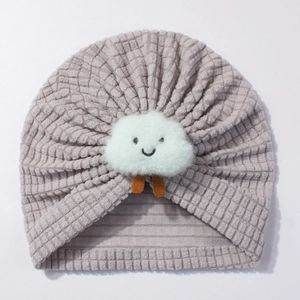 Close-up of light purple waffle knit baby hat with a white plush cloud smile applique