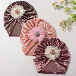 Three-pack velvet baby hats with lace floral decor in brown pink and purple