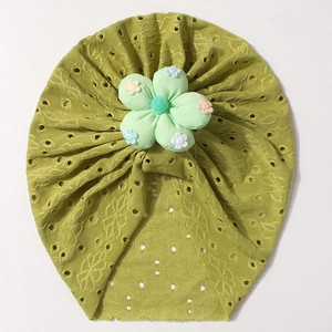 Close-up of olive green breathable hollow eyelet cotton baby hat with a floral patch