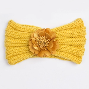 Winter knitted baby headband in mustard yellow featuring a large 3D handmade flower