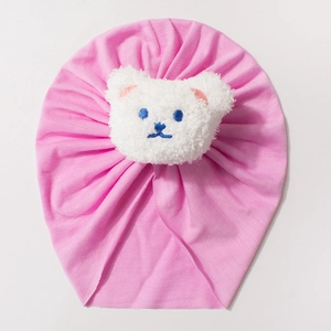 Pink cotton baby turban hat with a cute white plush bear decoration for newborns