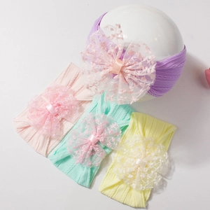Lot de quatre bandeaux bébé en nylon jacquard avec grands nœuds en dentelle colorés