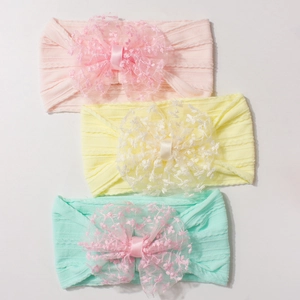 Lot de trois bandeaux bébé en nylon jacquard avec grands nœuds en dentelle pastel