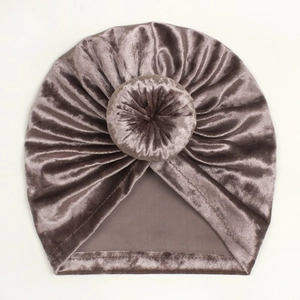 Detailed view of dark taupe velvet baby donut hat with soft texture and refined stitching