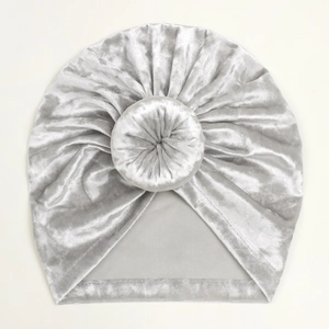 Detail view of silver grey velvet baby donut hat showing smooth texture and knot stitching