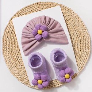 Detail of infant lavender turban and socks set with 3D decorative fabric flowers