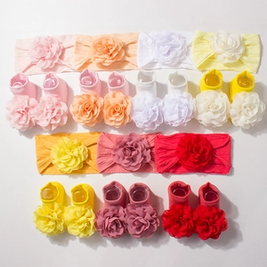 7-pack baby headband and socks set with large 3D flowers in multiple pastel colors