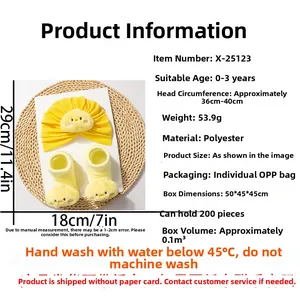 Detailed view of yellow baby knitted hat and socks set with cute 3D chick face design