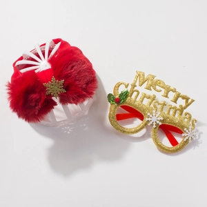 Detail of red Christmas bow headband with snowflake charm and gold Merry Christmas glasses