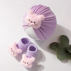 Cute lavender purple ribbed knit baby turban and sock set with pink plush pig decor
