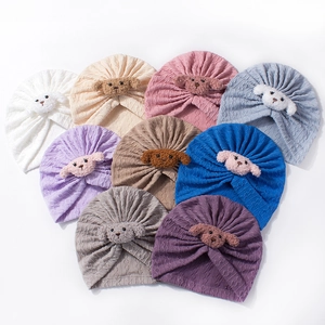 Set of baby knit beanies with cute 3D puppy decor in nine various soft colors