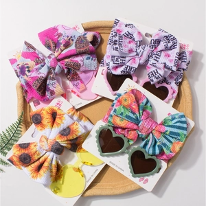 Ensemble bandeau bébé et lunettes de soleil coeur avec nœud floral et solaire