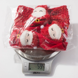 Weight measurement of 59.4g for the red knitted Christmas baby headband and socks set